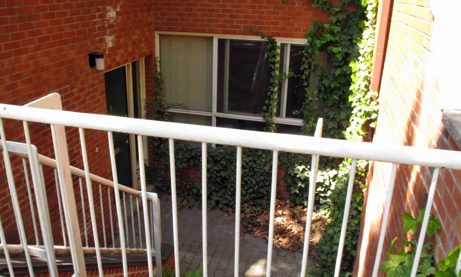 Sunken entry and small courtyard along Henry Street
