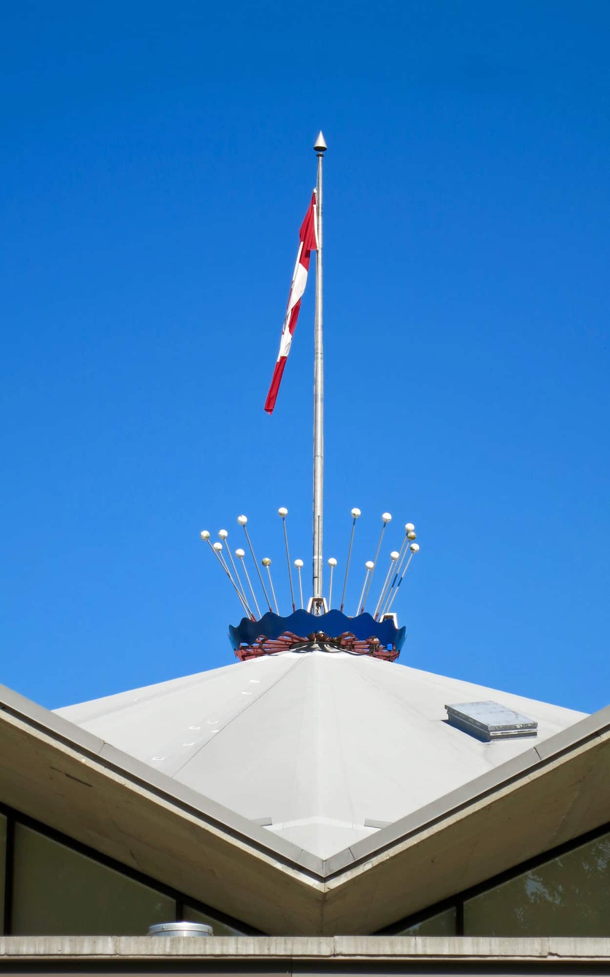 Roof-top flagpole and coronet finial