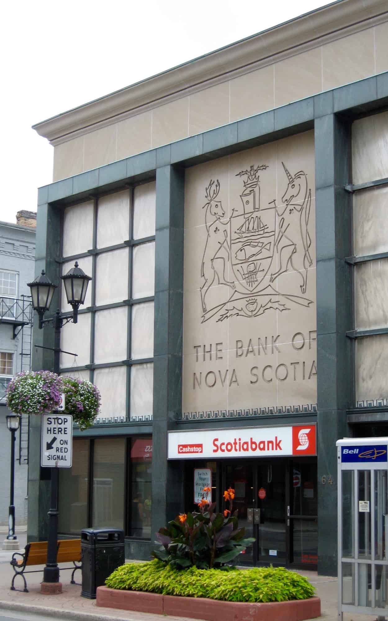 King Street facade dominated by armorial crest incised into the limestone panels