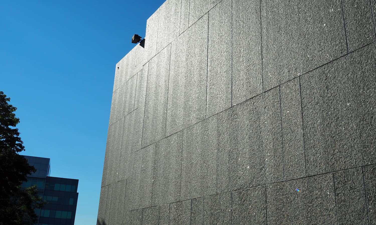 Detail of the granite cladding in the sunlight