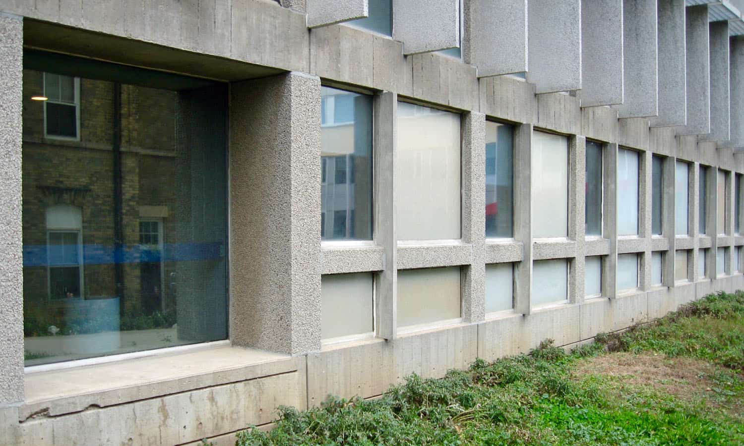 The east facade with considerable depth and texture achieved by precast and poured-in place concrete