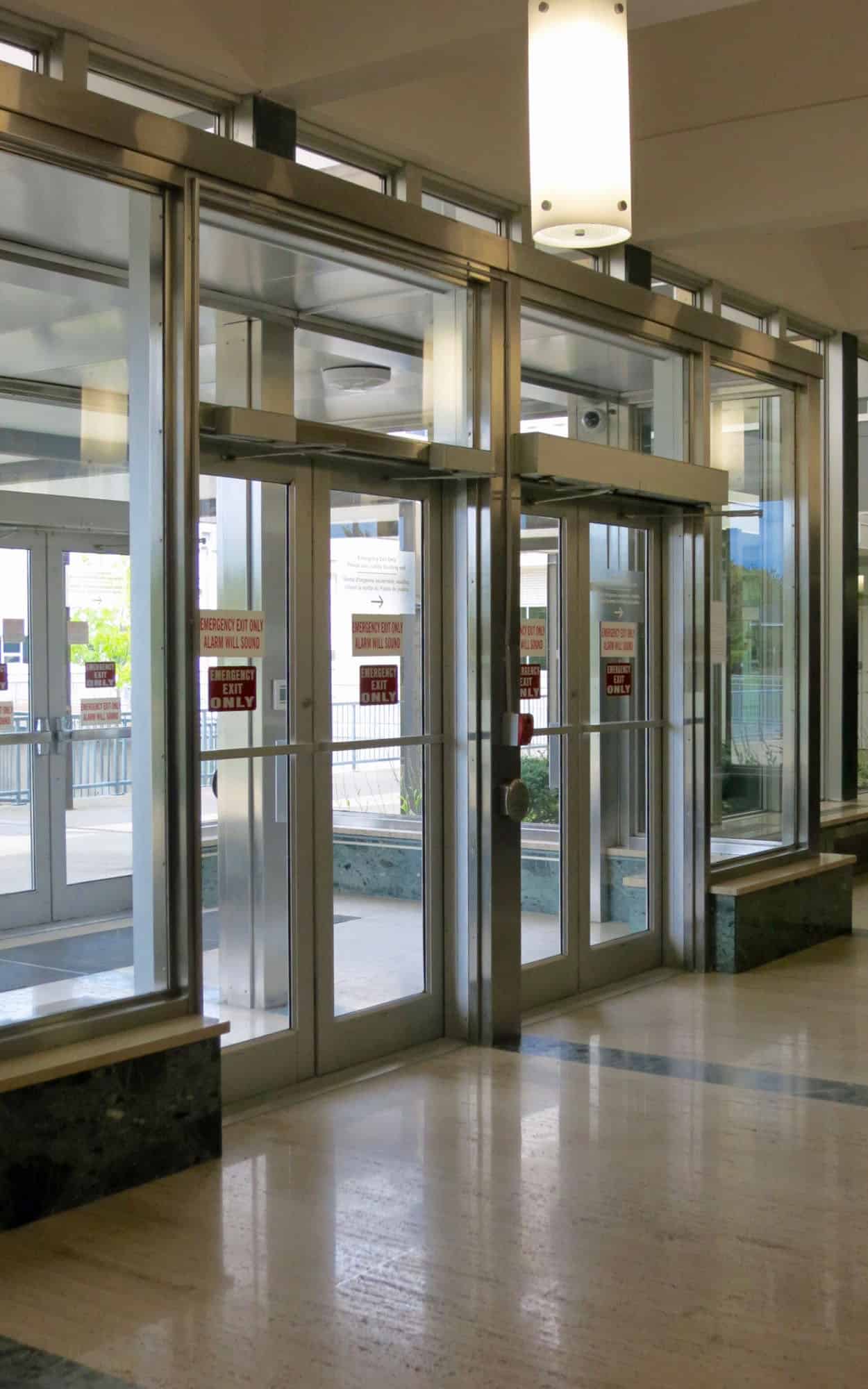 The lobby of the former administration building with its stainless steel detailing, travertine, and serpentine marble