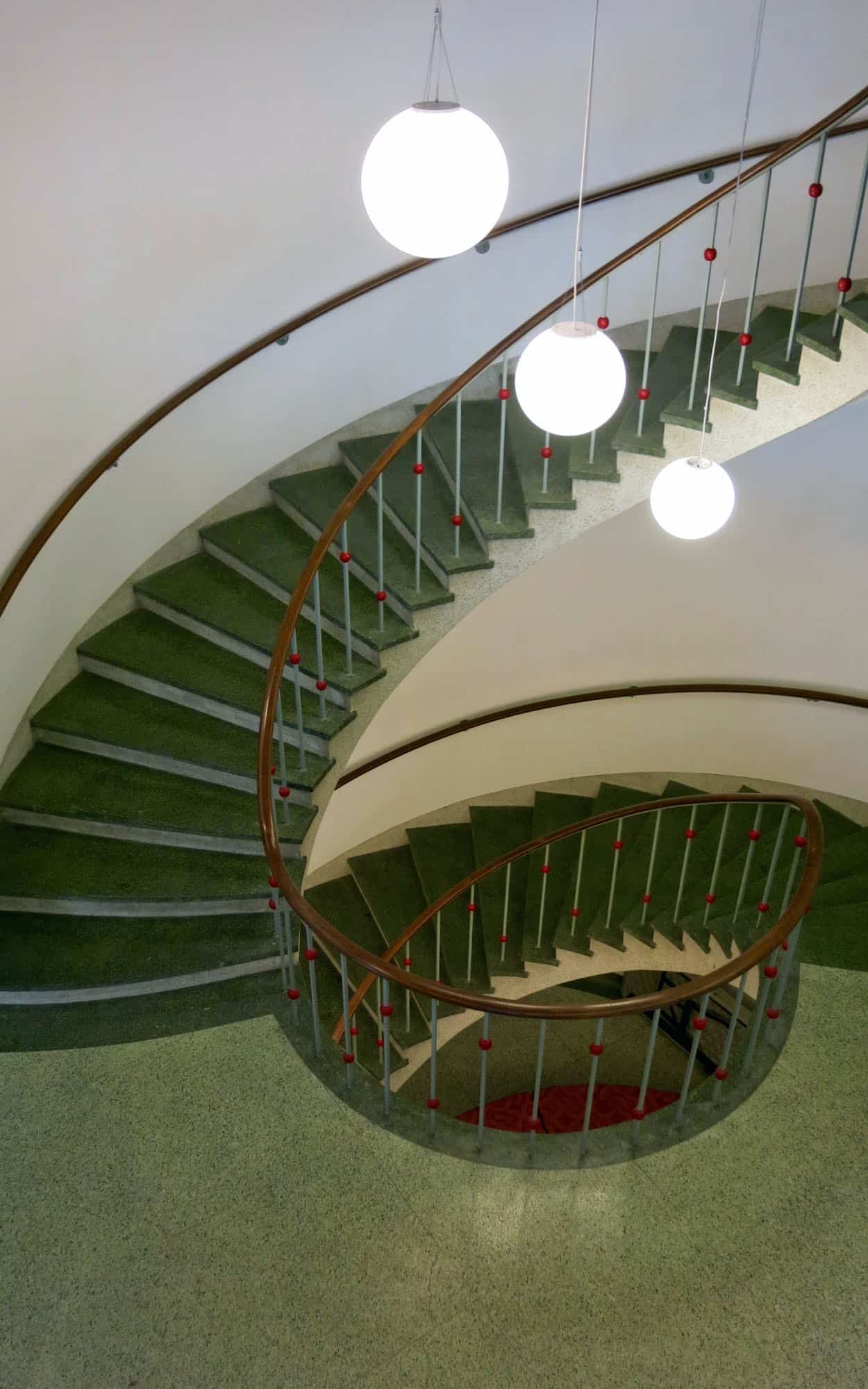 The dramatic, cantilevered, curvilinear stair connecting all three floors