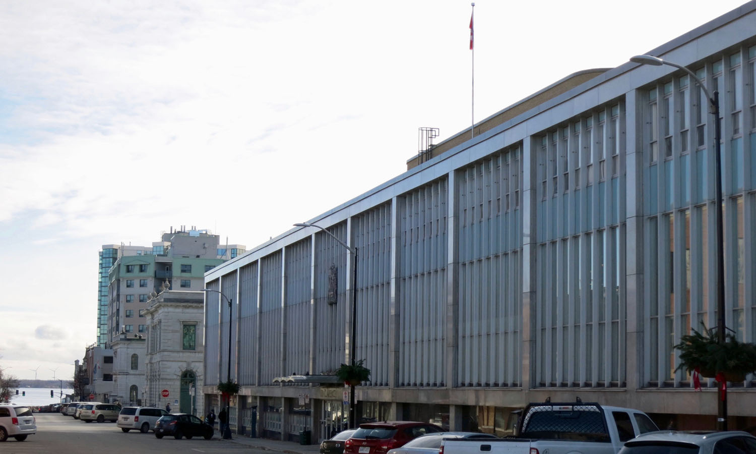 The monumental main facade runs the entire length of the block along Clarence St.