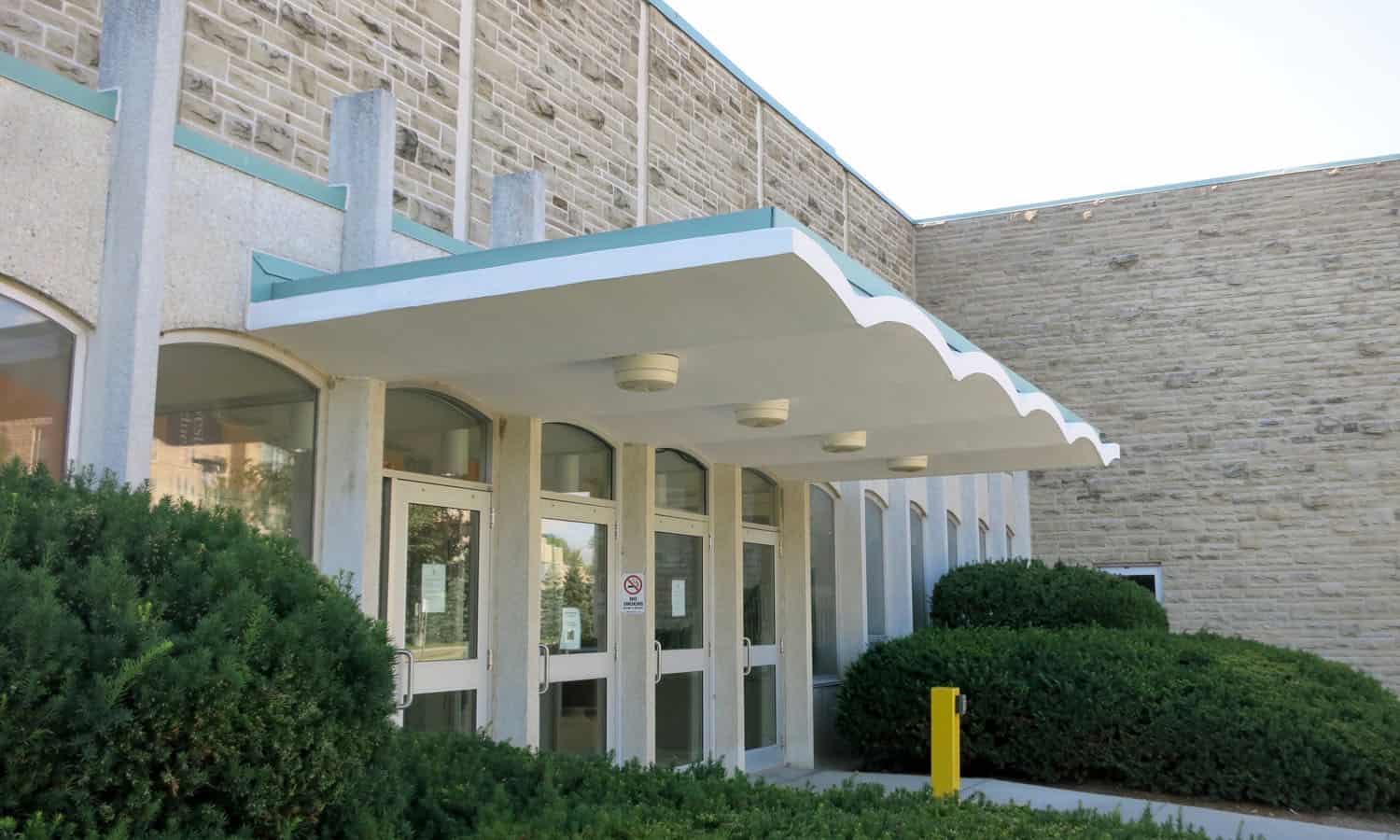 The cantilevred concrete entrance canopy