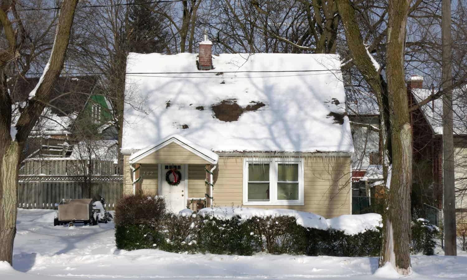 This typical house on Spadina Road East is characterized by its compact, rational plan, its modest size, its steep gabled roof, and its small porch